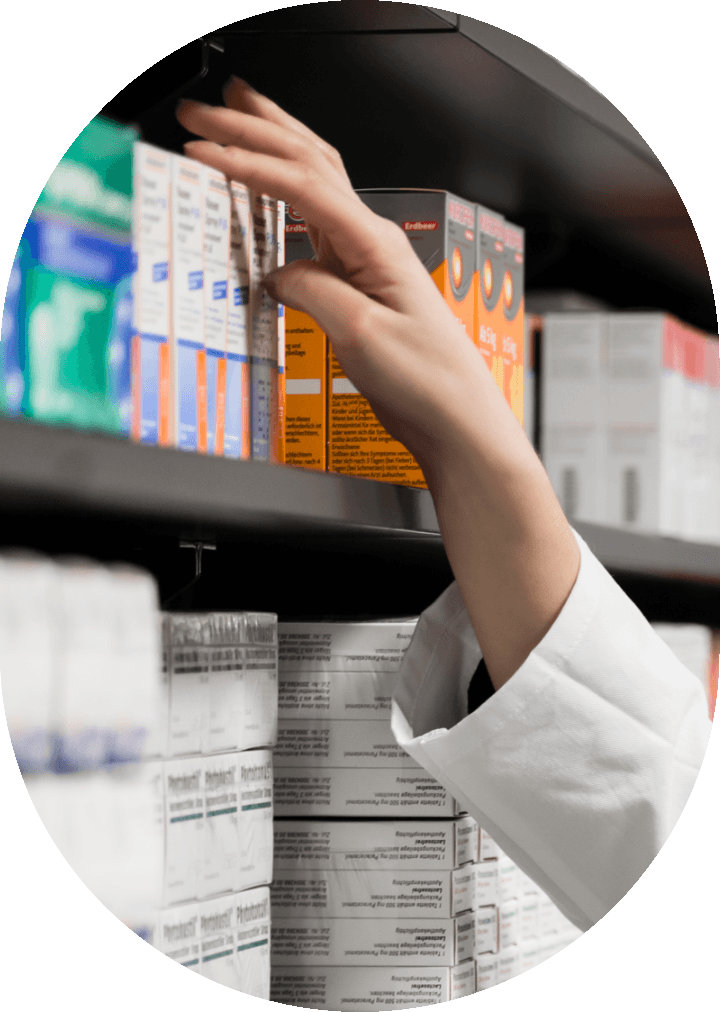 hand reaching for medicine on shelf